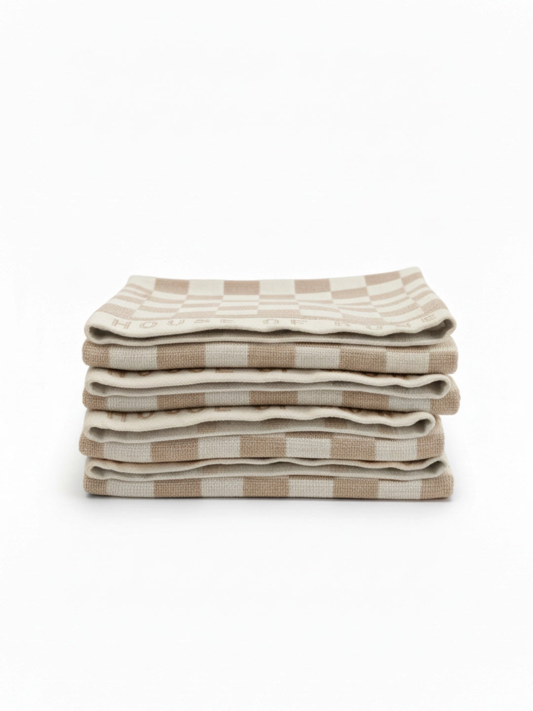 Stack of four House of Dune Sand Drift beach towels featuring a soft beige and white check pattern, folded for a refined coastal look.