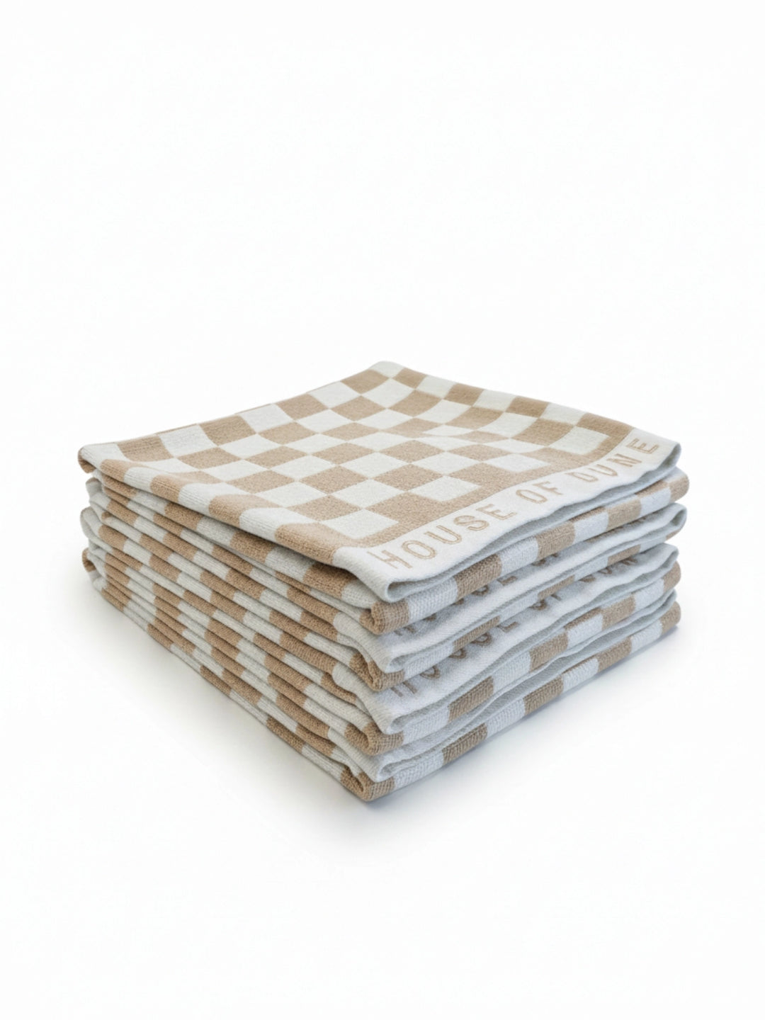 Stack of four House of Dune Sand Drift beach towels featuring a soft beige and white check pattern, folded for a refined coastal look.