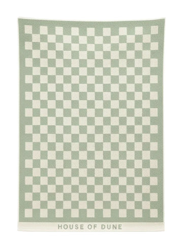 Full view of the Salted Sage checkerboard towel from House of Dune laid flat, showing its minimalist green and cream design.