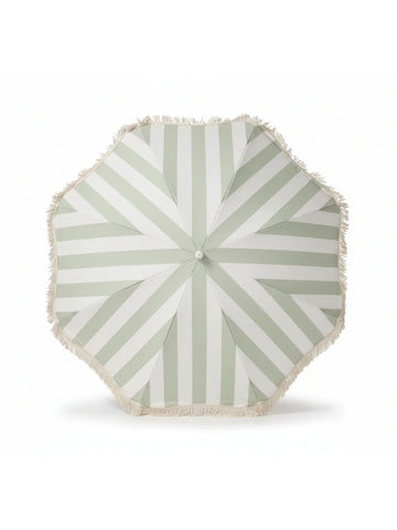Top-down view of the Salted Sage beach umbrella by House of Dune, featuring soft green and cream stripes with fringe trim.