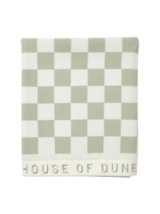 Folded Salted Sage checkered towel from House of Dune neatly displayed, highlighting its premium cotton texture and subtle branding.
