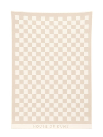 Full view of the Sand Drift checkerboard towel from House of Dune laid flat, showing its warm beige and cream design.