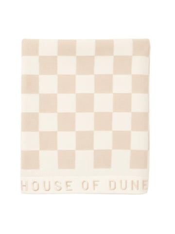 Folded Sand Drift checkered towel from House of Dune, highlighting its premium cotton weave and minimalist style.