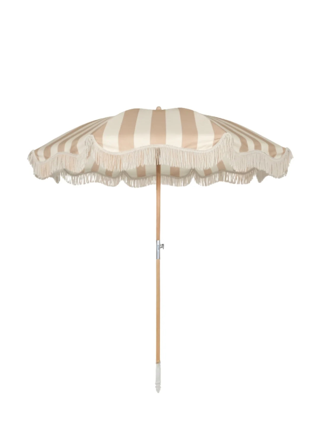 Upright Sand Drift beach umbrella from House of Dune with neutral beige and cream stripes, wooden pole, and fringe edging.
