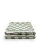 Set of two House of Dune Salted Sage beach towels with green and white checkerboard pattern neatly folded on a white surface.