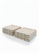 Six House of Dune Sand Drift beach towels folded in two stacks, alternate angle showing the beige and white check.
