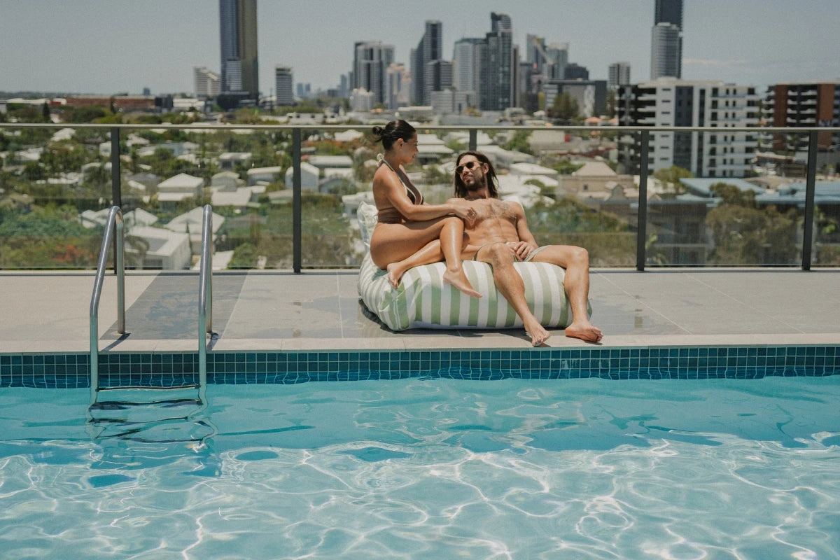 Salted Sage Floating Bean Bag Lounger by House of Dune, made from recycled RPET and styled poolside with a refined coastal aesthetic.